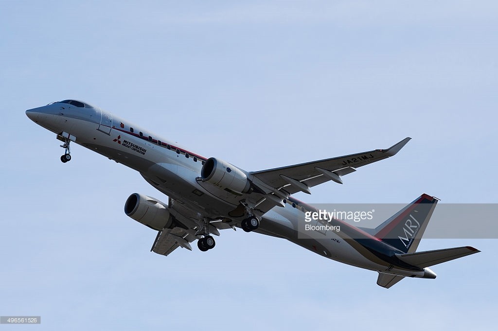 Mitsubishi Aircraft Corp.'s Mitsubishi Regional Jet takes off for its first flight at Nagoya Airport in Toyoyama Town, Aichi Prefecture, Japan, on Wednesday, Nov. 11, 2015. Mitsubishi Aircraft's new jet took off on its debut flight from Nagoya airport in central Japan, half a century after the country last introduced a new passenger plane. Photographer: Akio Kon/Bloomberg